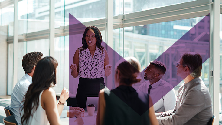 Woman giving a presentation to her team