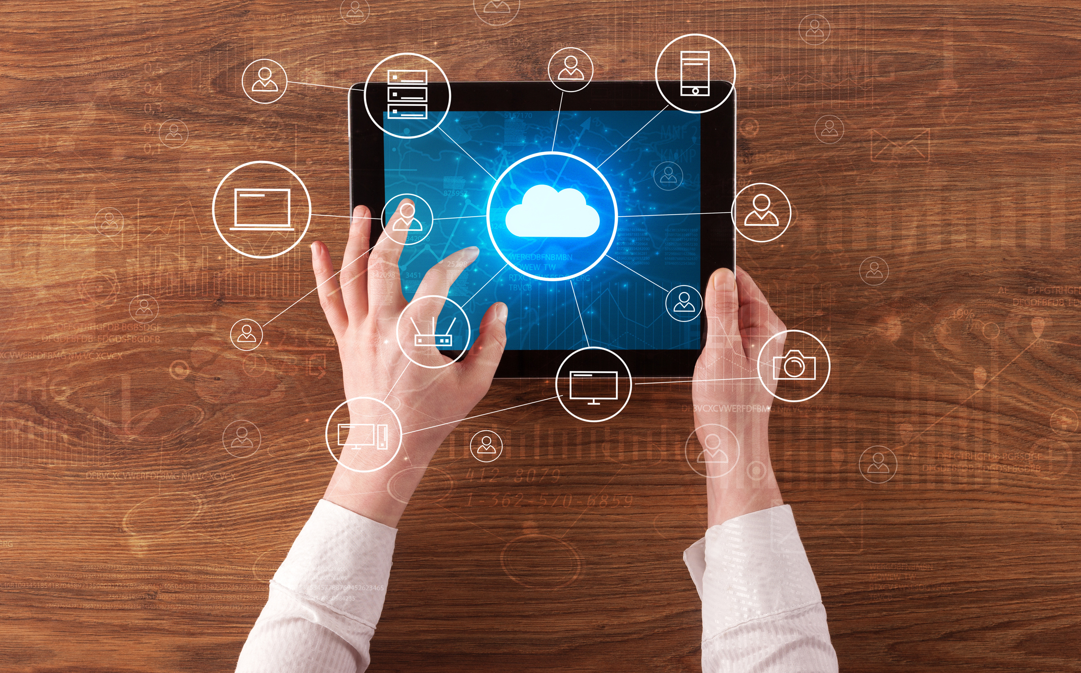 Hand using tablet with centralized cloud computing system concept